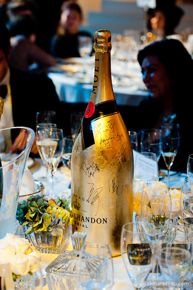 Celebrities autographs on a champagne