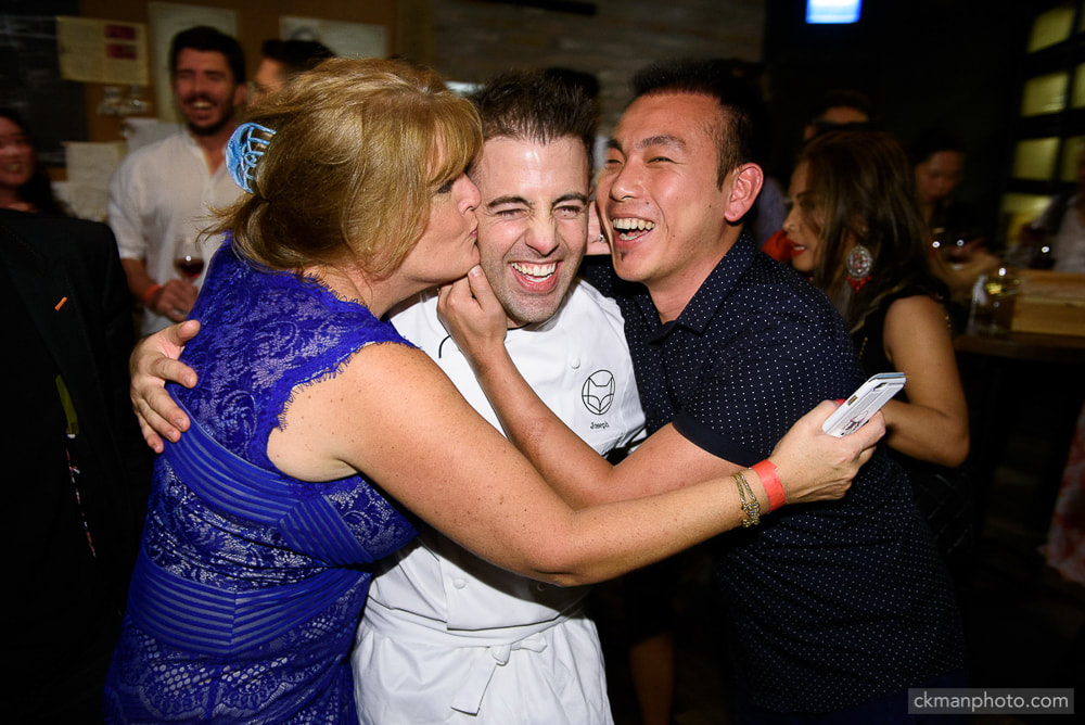 Guests kiss the chef at Mr & Mrs Fox restaurant grand opening party